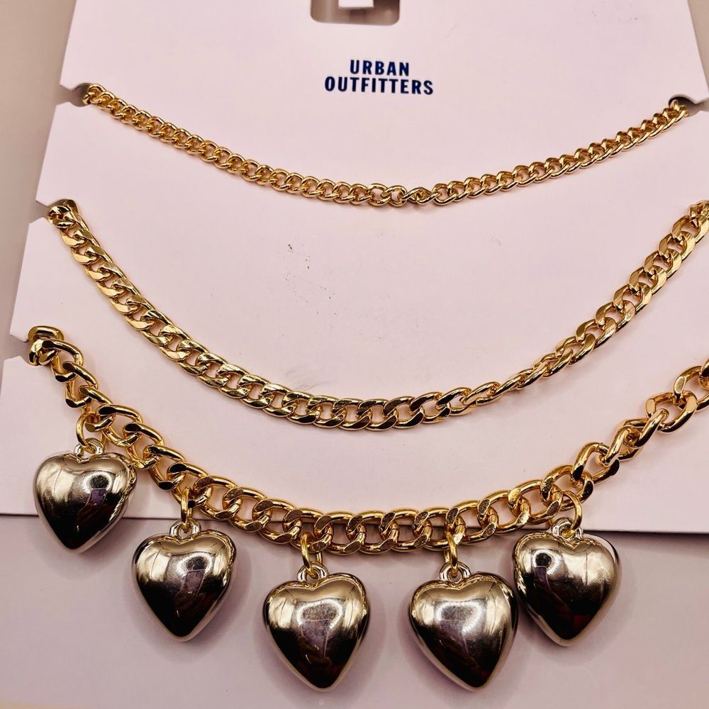 Urban Outfitters heart charm layering necklaces. 3 gold tone chains. Statement